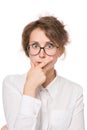 Girl in a white blouse stands on a white background, gestures, emotions on her face