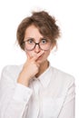 Girl in a white blouse stands on a white background, gestures, emotions on her face