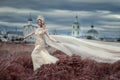 Girl in white dress on background of the Church