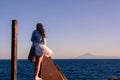 Young girl at the edge of cliff at Thassos Royalty Free Stock Photo