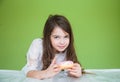 Girl in a white dress is going to eat a sweet donut Royalty Free Stock Photo