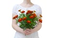 A girl in a white dress is holding a bouquet of flowers in her hands. isolate Royalty Free Stock Photo