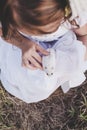 Girl holding white hamster - Top view - Retro look