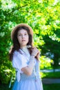 Girl in white dress near blooming apple tree Royalty Free Stock Photo