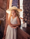 little girl with blond near the window Royalty Free Stock Photo