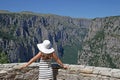 Girl with white hat on the viewpoint Vikos gorge