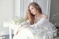 Girl white light dress and curly hair, portrait of woman with fl Royalty Free Stock Photo