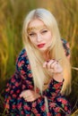 Girl with white long hair in an autumn forest