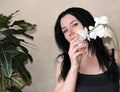 Girl with white orchid Royalty Free Stock Photo