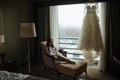 Girl in white panties and stockings is leaning on the chair. Royalty Free Stock Photo