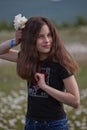 Girl with white poppy flower