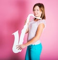 Girl with white saxophone Royalty Free Stock Photo