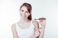 Girl with white teeth smiles shows the toothbrush Royalty Free Stock Photo