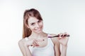 Girl with white teeth smiles shows the toothbrush Royalty Free Stock Photo