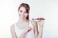 Girl with white teeth smiles shows the toothbrush Royalty Free Stock Photo