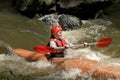 Girl white water kayaking Royalty Free Stock Photo