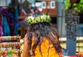 Girl with a white wreath of flowers, Rarotonga, Aitutaki, Cook Islands. With selective focus. Back view