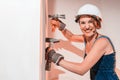 Girl who is builder, painter, worker being in a renovated room Royalty Free Stock Photo