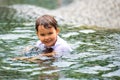 Girl who swims dressed in the downtown fountain