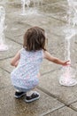 Girl who wallow in a fountain on a hot summer day Royalty Free Stock Photo
