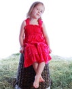 Girl on a wicker basket Royalty Free Stock Photo