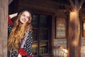 Girl in the Wild West, in Western house. Girl in hat with long cerly hair smile. Beautiful pretty girl in black hat. Royalty Free Stock Photo