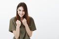 Girl will fight for happiness. Indoor shot of cheerful good-looking european female student with playful expression