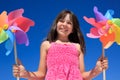 Girl with windmill toys Royalty Free Stock Photo