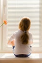 Girl on window-sill Royalty Free Stock Photo