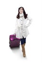 Girl in winter clothes carrying suitcase Royalty Free Stock Photo