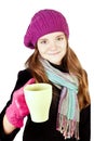 Girl in winter clothes holding cup of cure