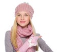 Girl in winter clothes pointing on copy space Royalty Free Stock Photo