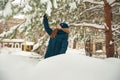 Girl in the winter forest close-up and copy space. A child plays in the winter with snow Royalty Free Stock Photo