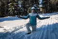 Girl in the winter forest playing snowballs