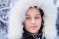 Girl in winter fur hood.