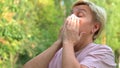 Girl wipes her face with a napkin after eating, hygiene and etiquette , close-up. selective focus Royalty Free Stock Photo