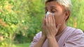 Girl wipes her face with a napkin after eating, hygiene and etiquette , close-up. selective focus Royalty Free Stock Photo