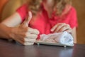 The girl wipes her hands with a hot towel rolled into a roll in Royalty Free Stock Photo