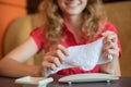 The girl wipes her hands with a hot towel rolled into a roll in a Japanese restaurant before eating Royalty Free Stock Photo