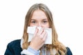 A girl wipes her nose with a handkerchief Royalty Free Stock Photo