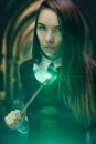 The girl wizard with a magic wand. dark magic, Royalty Free Stock Photo