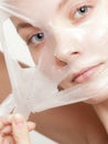 Girl woman in facial peel off mask. Skin care. Royalty Free Stock Photo