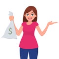 Girl, woman or female holding/showing money, cash or currency notes bag with dollar sign and gesture hand, presenting something.