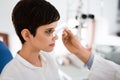 Girl woman in ophthalmology clinic for diopter detection Royalty Free Stock Photo