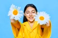 woman smile happiness blue portrait young yellow girl model chamomile flower Royalty Free Stock Photo