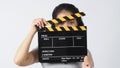 Girl or woman wear contact lenses and hand`s holding black clapper board or movie slate use in video production ,film, cinema Royalty Free Stock Photo