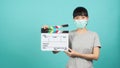 Girl or woman wear face mask and hand`s holding black clapper board or movie slate use in video production ,film, cinema industry Royalty Free Stock Photo
