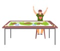 Girl won game joyfully raises her hands up, sitting near table with colored board game and coins