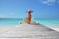 Girl on the wooden jetty. Exuma, Bahamas