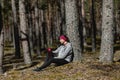 Girl in the woods drinks water after jogging Royalty Free Stock Photo